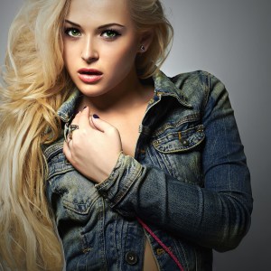 fashionable beautiful girl in jeans.blond Sexy woman.Long hair